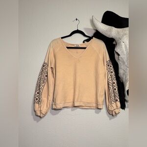 Beige V-Neck Sweater with Patterned Long Sleeves